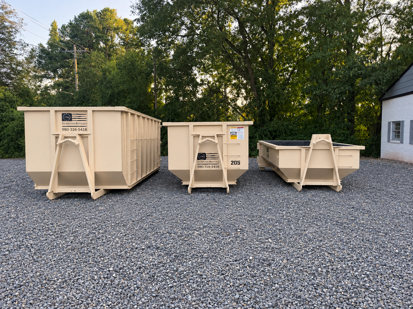1776 dumpsters side by side: 30 yard on the left, 20 yard in the center and 10 yard on the right